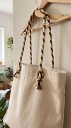 Beige tote bag in canvas with filamento lurex braided brown and cream rope handles tied with knots