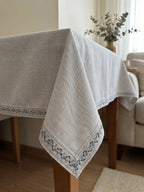 Light gray linen tablecloth with delicate galão fio embroidered leaf border in darker gray thread l&l 80 algodão